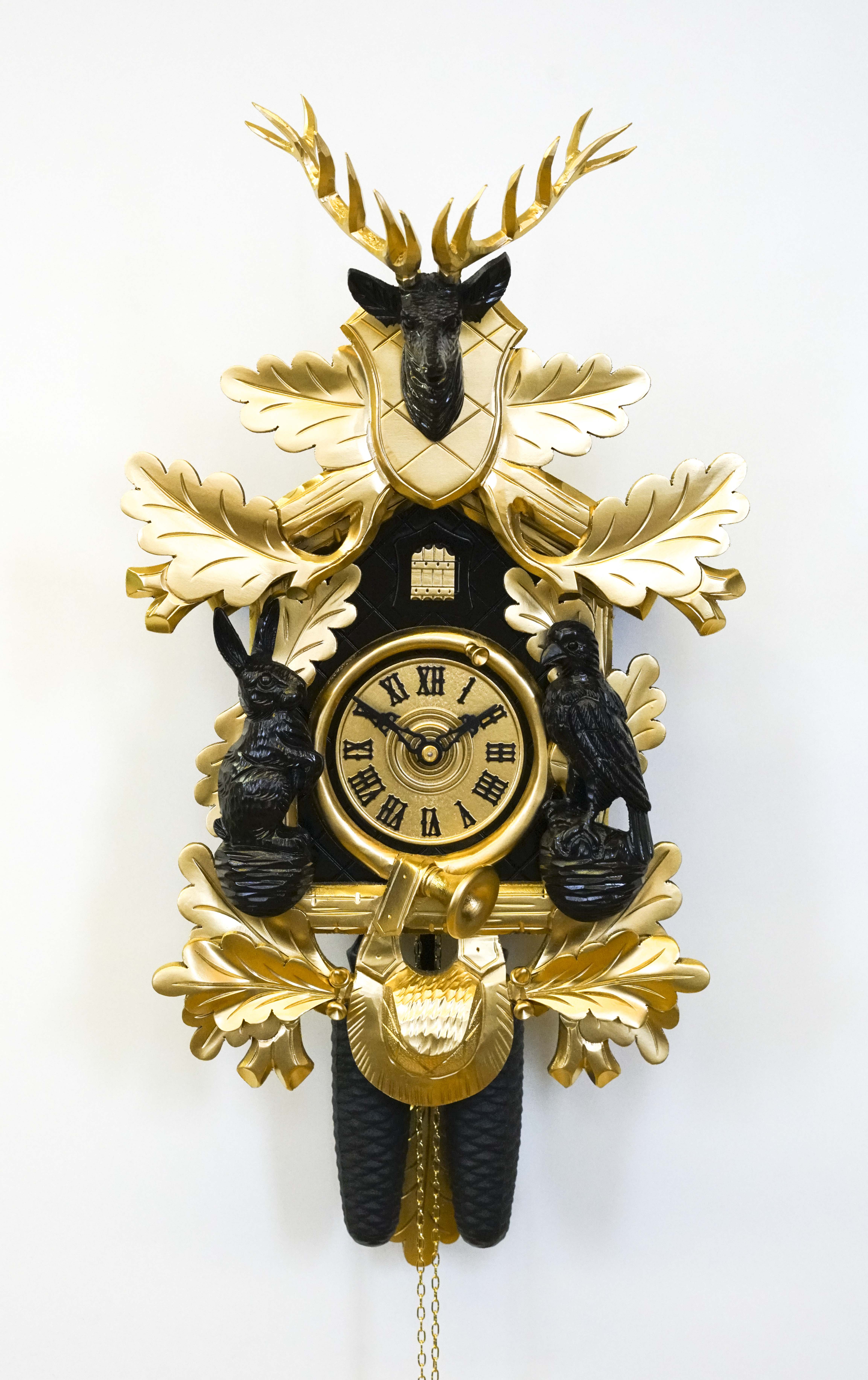 Kuckucksuhr gold/schwarz (Serie)